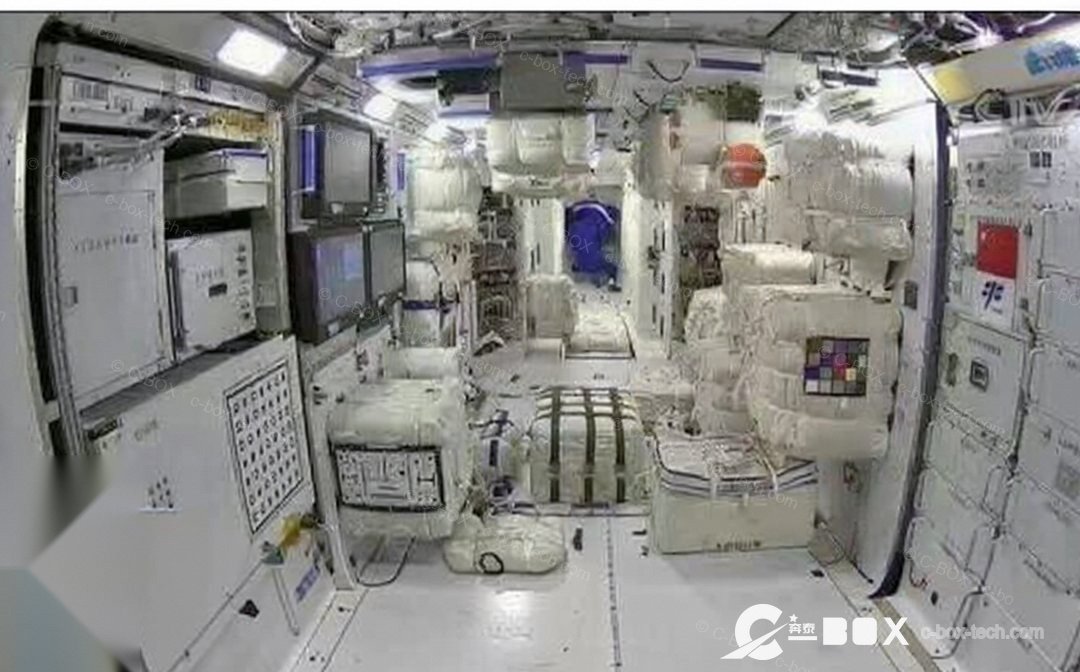 Interior of the Tianhe core module, China's space station — equipment racks carrying cabinet hardware supplied by C-BOX